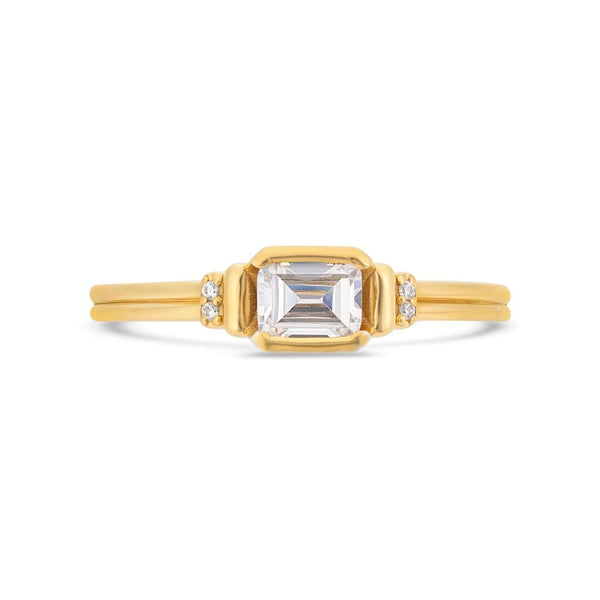 Deco emerald cut solitaire diamond ring in yellow gold